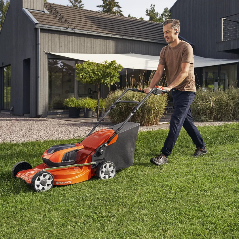 Husqvarna LC 142iS Cordless Lawn Mower with battery and charger